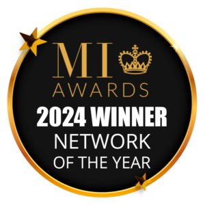 Circular black and gold award badge reading “MI Awards 2024 Winner – Network of the Year”, with a gold crown above the letters MI and small gold stars around the border.